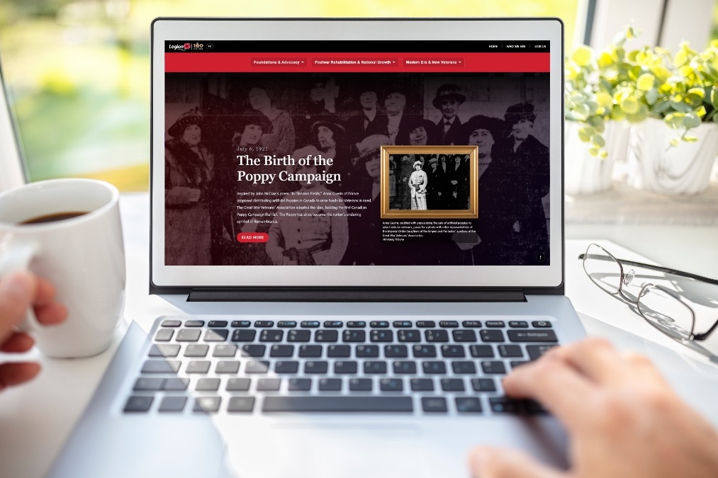 Open laptop on a desk with the Legion's new history website displayed